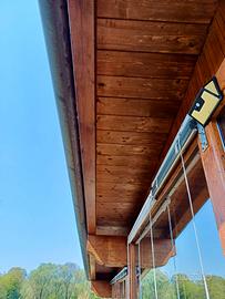 Veranda in legno lamellare  70mq con vetri doppi