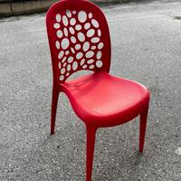 Sedia rossa design forata in polipropilene nuova