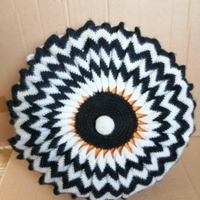 Cuscino bianco-nero rotondo