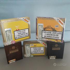 Lotto di cinque scatole in legno vuote per sigari.