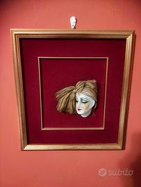 quadro con faccia in porcellana bisque
