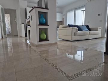 Luminoso quadrilocale con posto auto