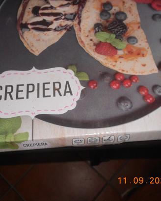 Pentola per cuocere le crepes ed altri alimenti .