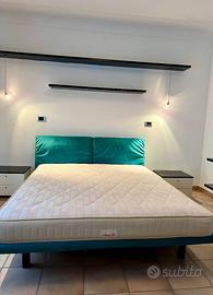 Letto matrimoniale con poggiatesta reclinabili