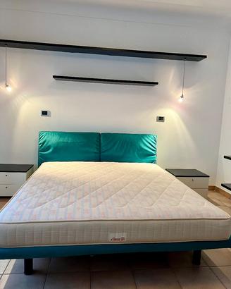 Letto matrimoniale con poggiatesta reclinabili