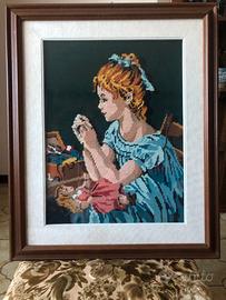 Quadro a mezzopunto "Ragazza che cuce una bambola"