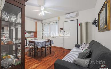 APPARTAMENTO CON GIARDINO E POSTO AUTO