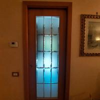 Porta a a scrigno noce e vetro