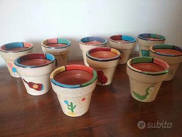 Dieci porta vaso decorati
