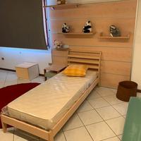 LETTO SINGOLO CON BOISERIE IN LAMINATO DI BERLONI