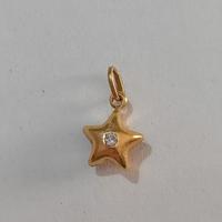 ciondolo in oro 750 a forma di stella con pietra 