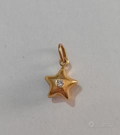 ciondolo in oro 750 a forma di stella con pietra 