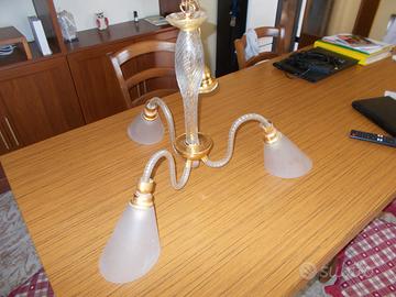 Lampadario ed affettatrice