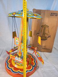 Giostra razzi anni '40/'50 con missili in latta.