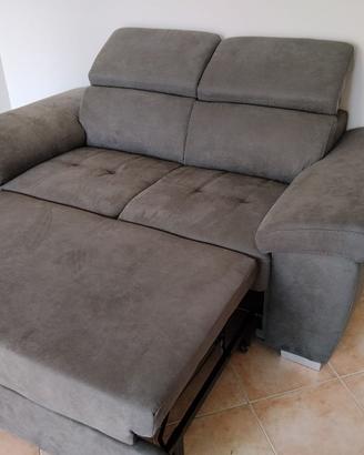 Divano  nuovo,due posti letto.