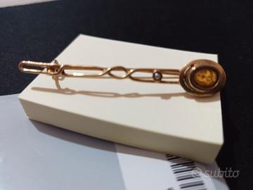 Spilla in oro