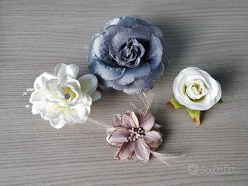 Spille e mollette con fiori in tessuto