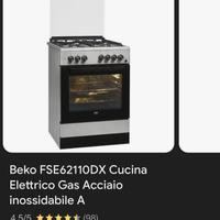 Cucina 4 fuochi a gas con forno elettrico.