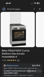 Cucina 4 fuochi a gas con forno elettrico.