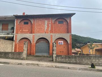 Arbus-Fabbricato allo stato grezzo con commerciale