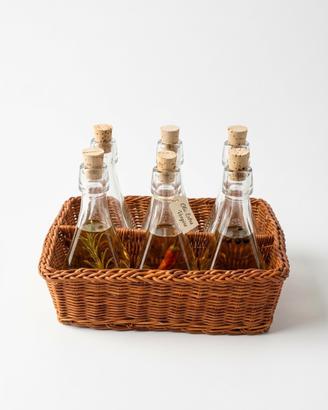 Set 6 bottiglie da 60 ml.  con cestino vimini
