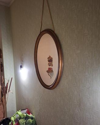 Specchiera ovale da muro patina dorata 