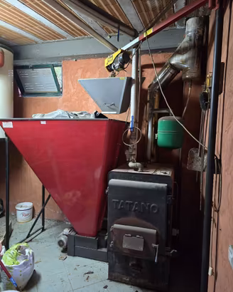Caldaia a sansa Tatano 69,77 kW con silos e canna