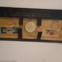 Moneta d'argento e fracobolli