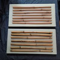 Due pannelli decorativi in cera dura e canne di