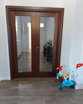Doppia porta battente con vetro