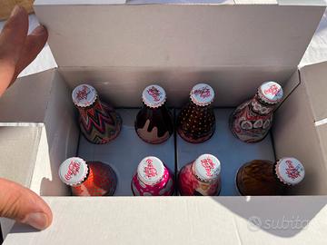 8 bottiglie coca-cola serie completa