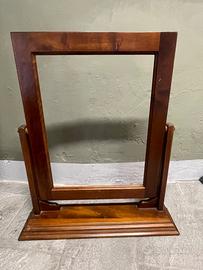 Cornice per specchiera basculante