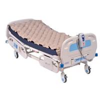 Sedia a rotelle e materasso anticupido