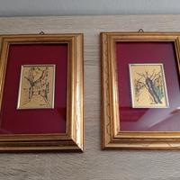 Due quadri con disegno su colore oro 22 carati 