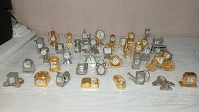 collezioni di 40 Orologi a forma di oggetti vari.