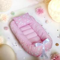 Nido riduttore di lettino nuvole rosa