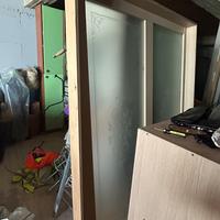 Porta scorrevole con vetro