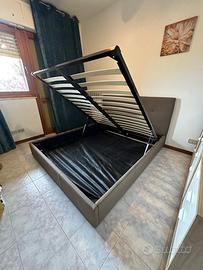 Letto contenitore con testiera imbottita