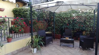 Bilocale con giardino in centro