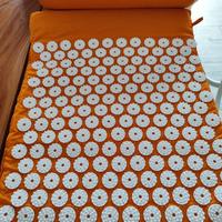 Tappeto e cuscino per agopressione 