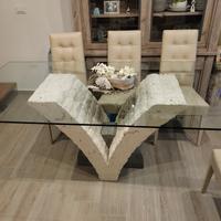 tavolo in cristallo con piede in pietra