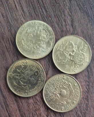 Quattro monete da duecento lire commemorative