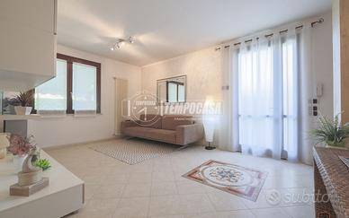 PORZIONE DI BIFAMILIARE CON GIARDINO