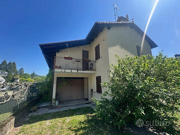 Casa singola con ampio giardino e terreni