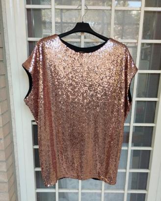 Blusa con paillettes rosa antico.