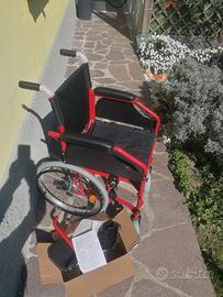 Carrozzina pieghevole invalidi