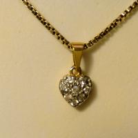 Ciondolo a cuore in oro giallo 750% 18k e zirconi