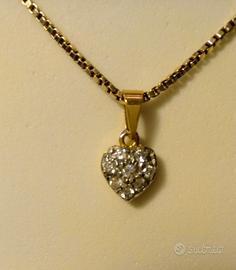 Ciondolo a cuore in oro giallo 750% 18k e zirconi