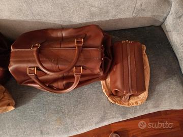 coppia di borse da viaggio in pelle