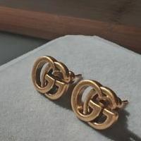 Orecchini a borchie in oro doppio Gucci